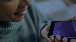 A close up of a woman speaking into a cell phone